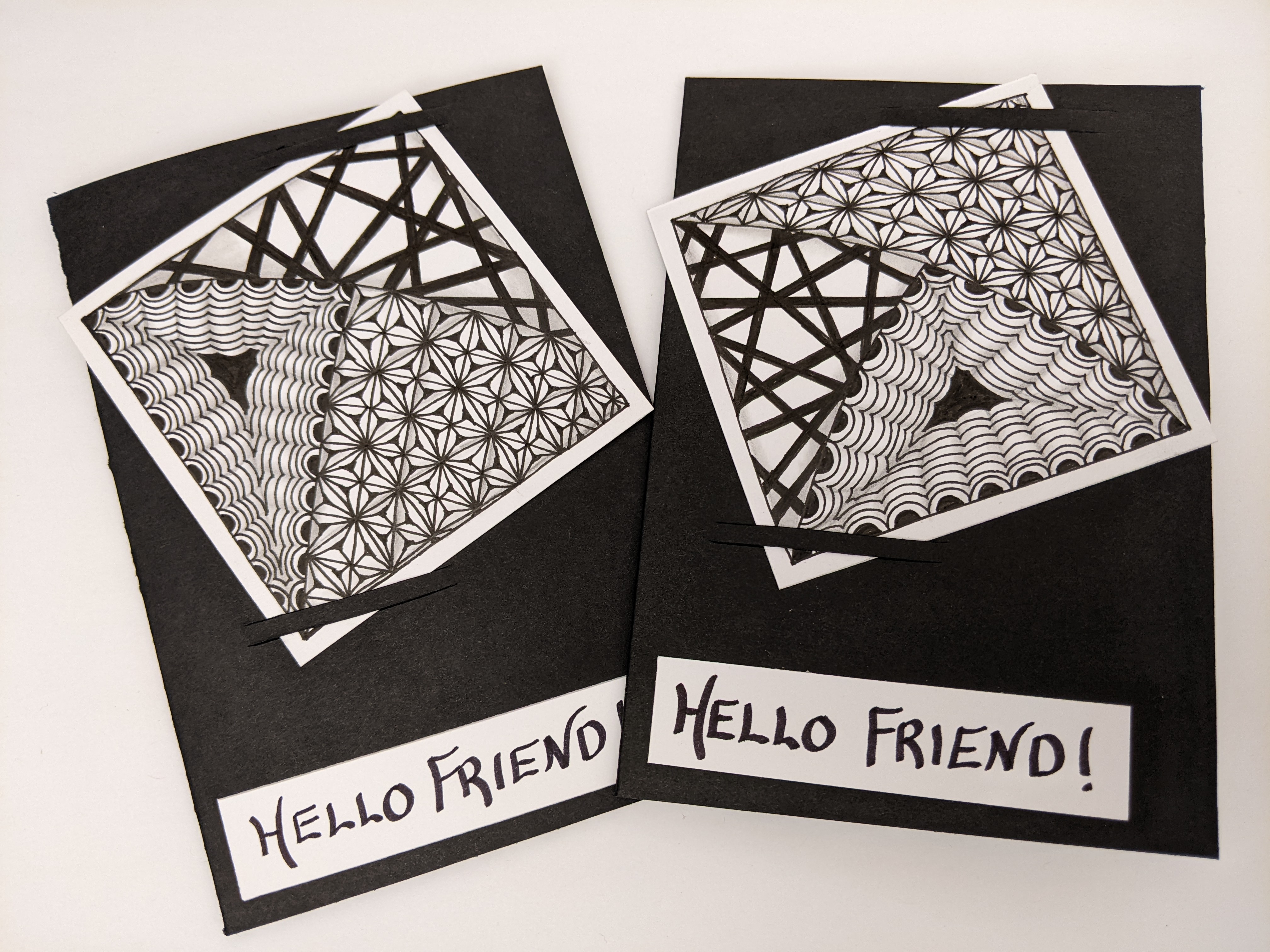 Two black and white cards made using the Zentangle method.